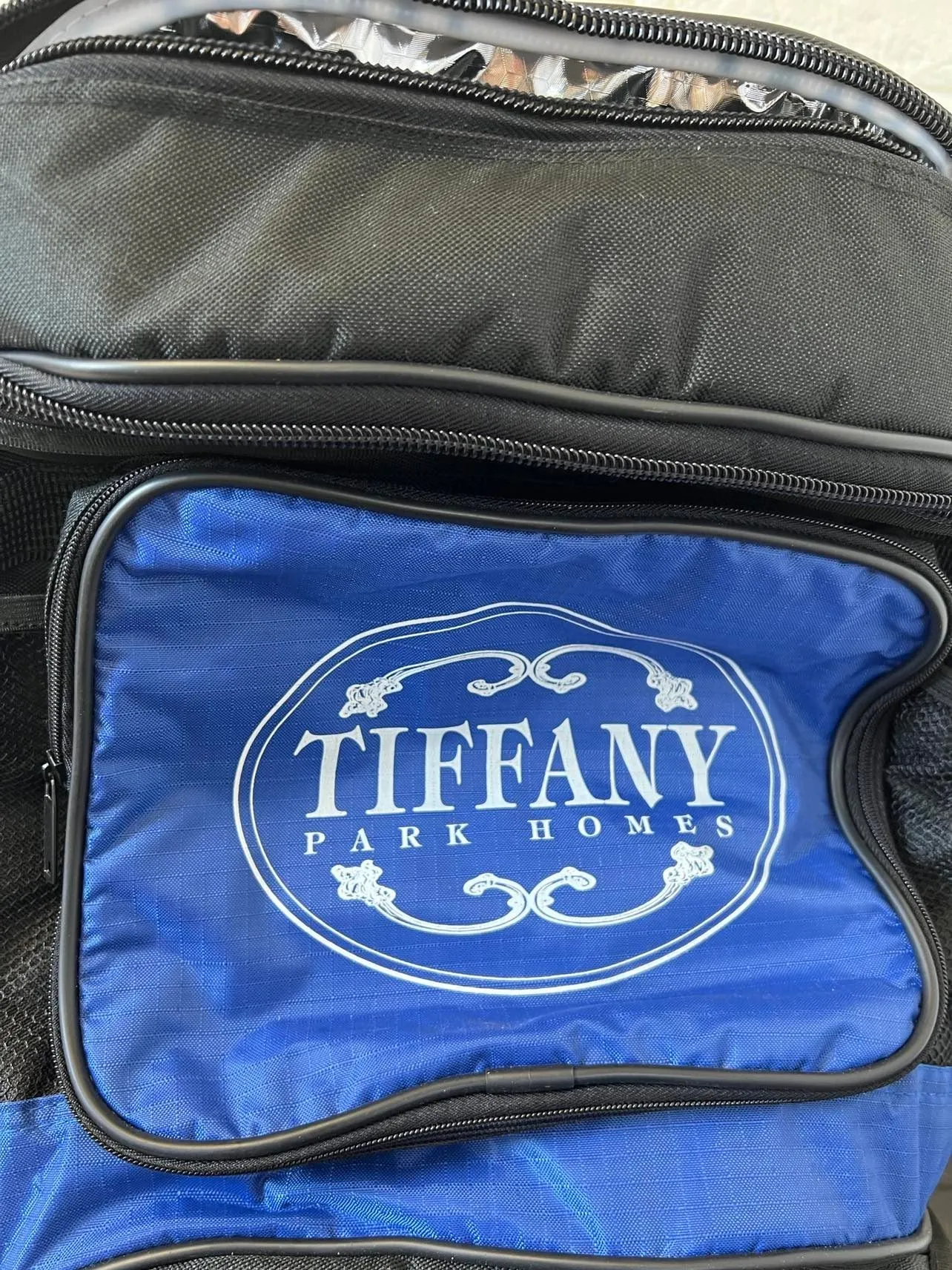 New Deluxe Wheeled Duffle Cooler Bag, Branded Tiffany Park Homes, Retails $120  Note: 1 side of plastic handle has a small crack still works fine-could tape it